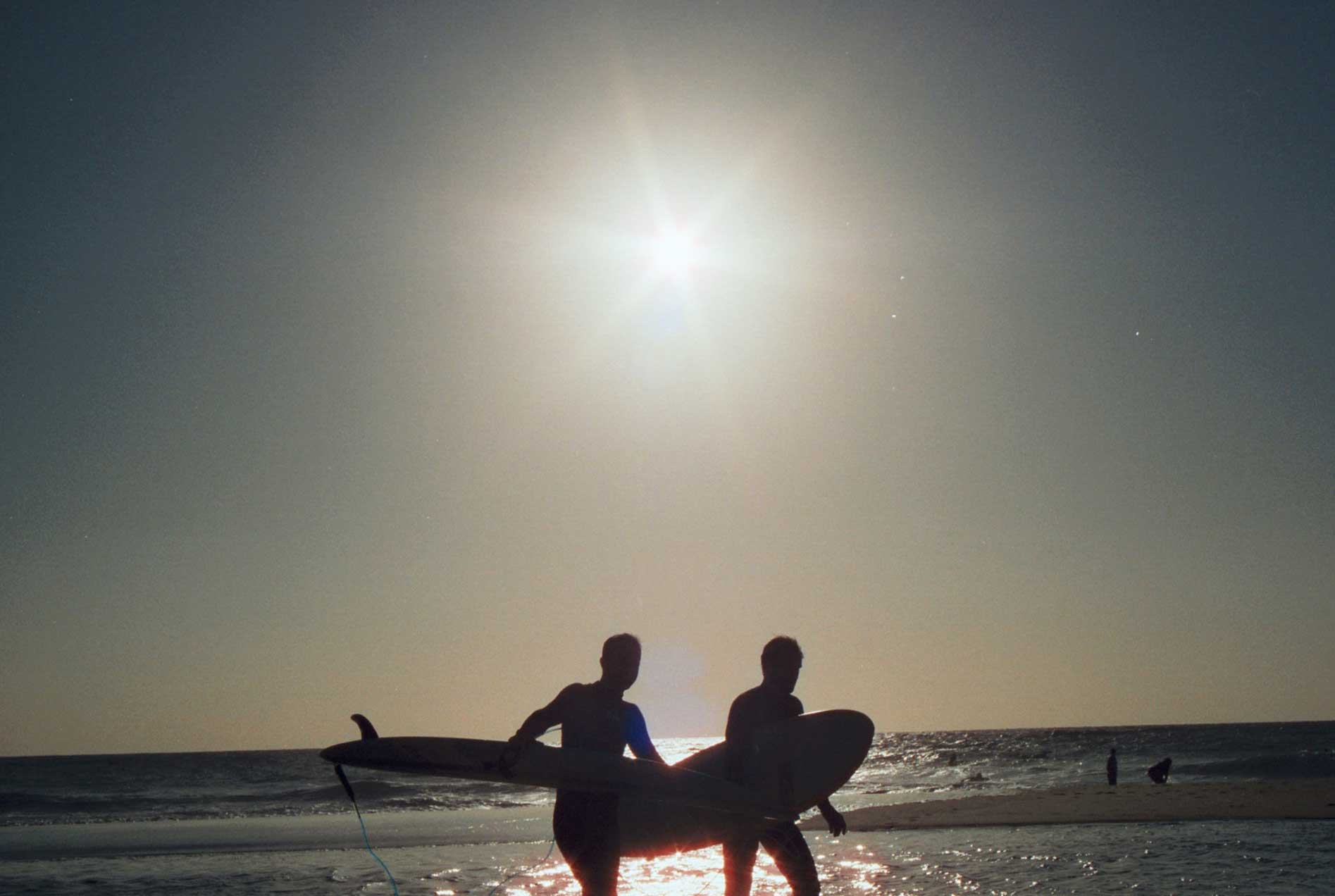 Surfer coming back to the sea