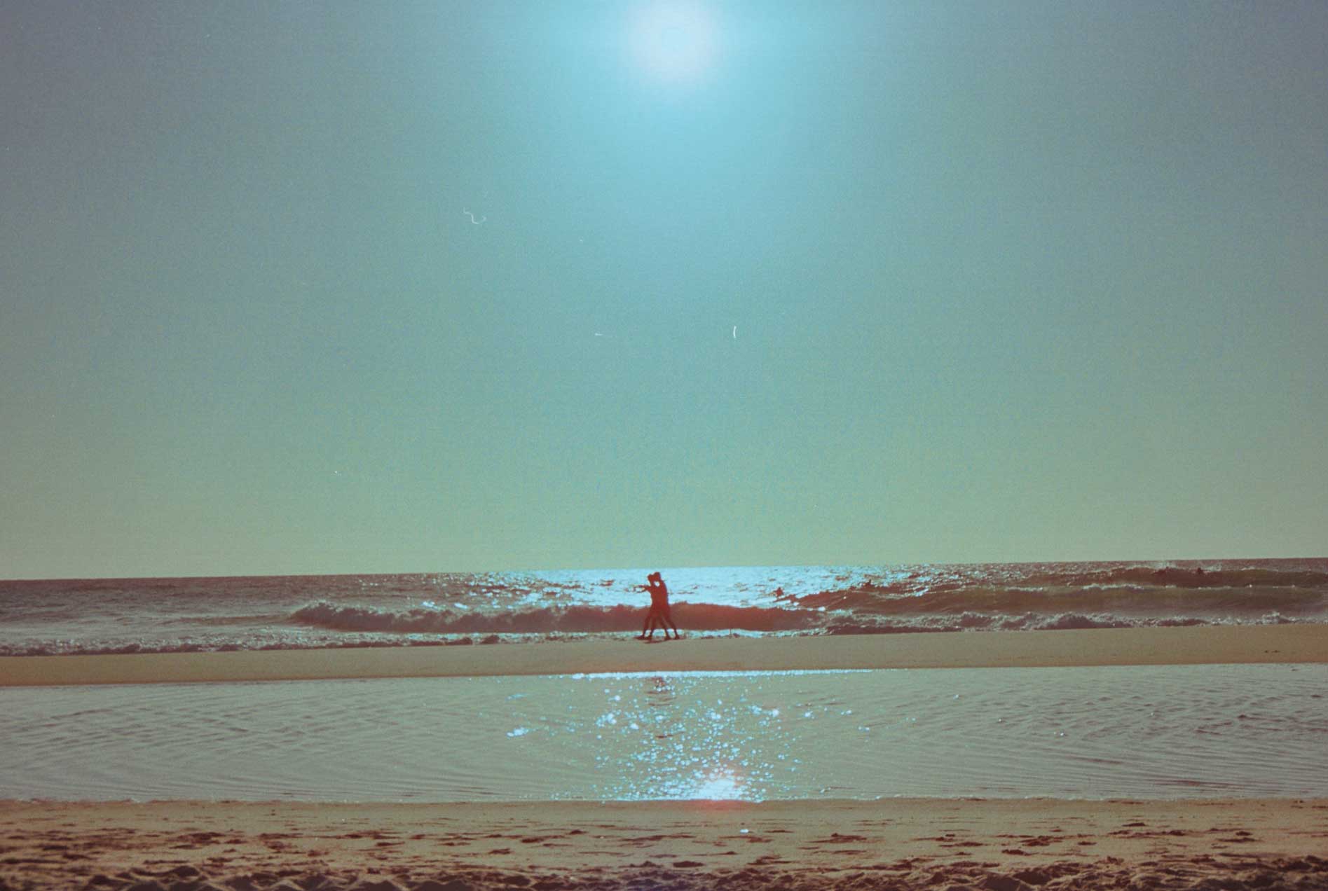 Guy running along the sea
