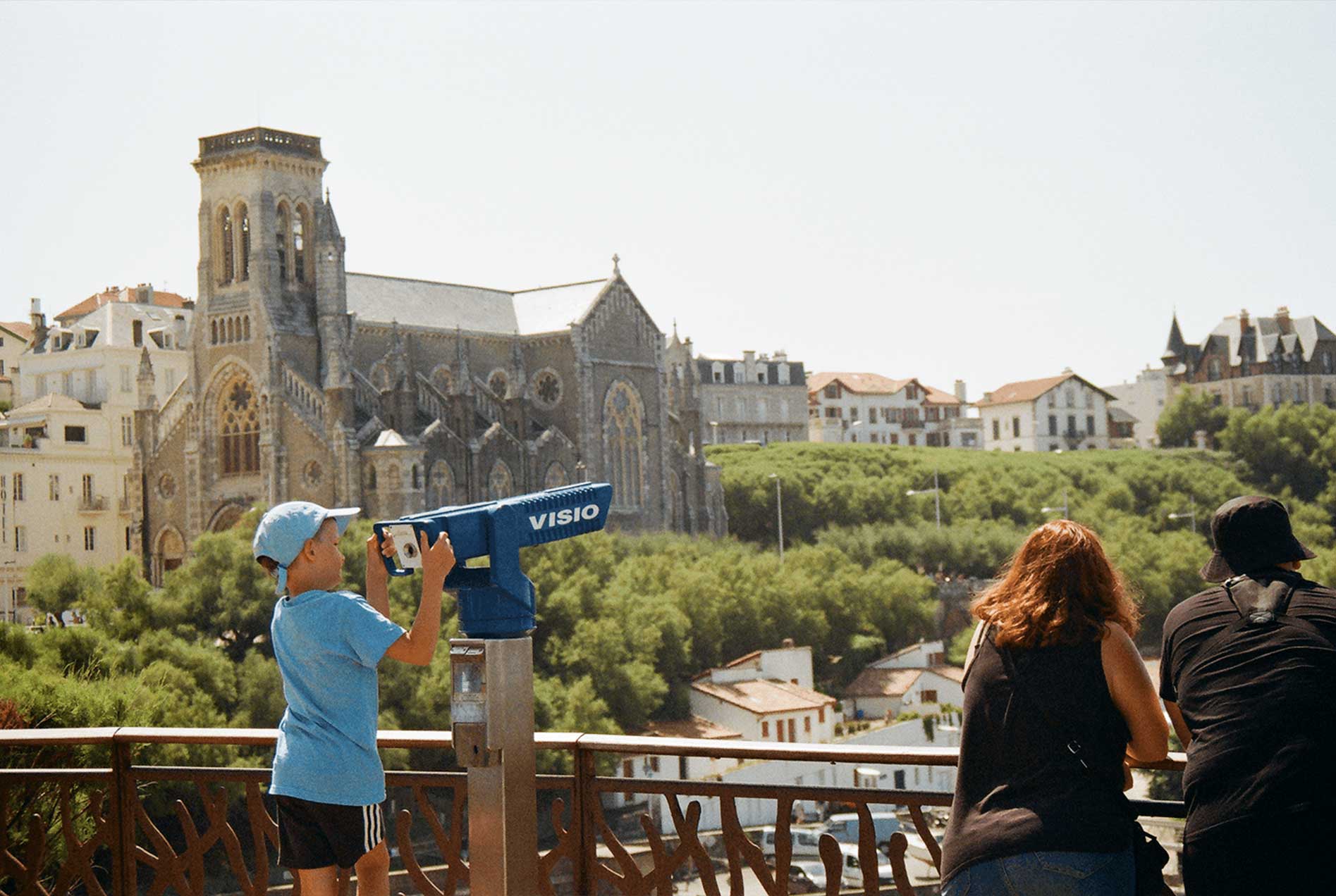 Kid with scope looking the horizon